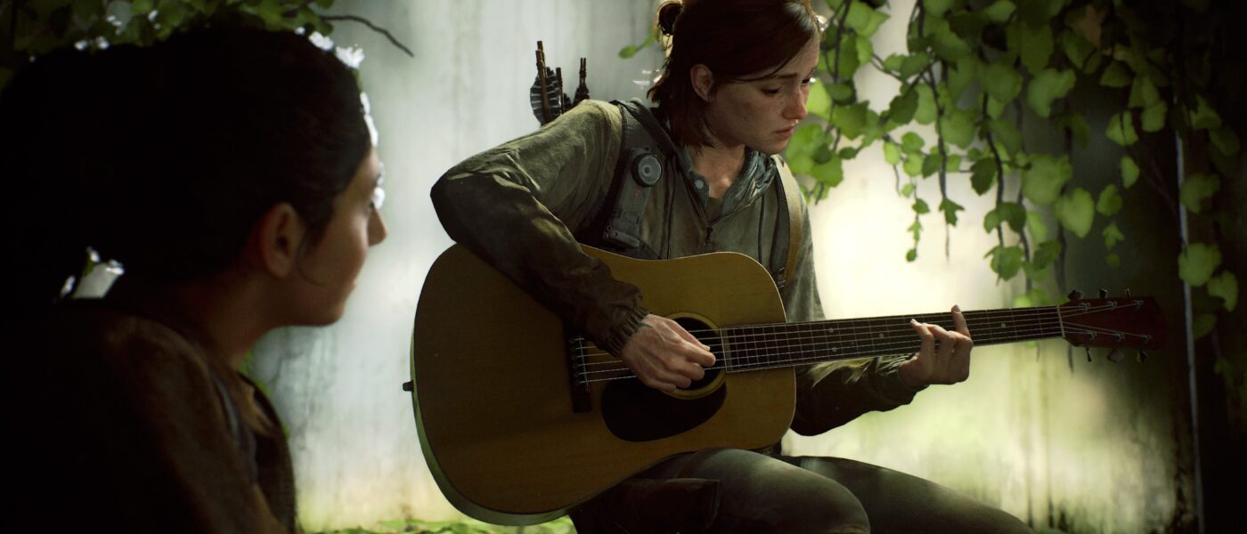 Ellie and Dinah in The Last of Us Part II. Ellie is playing a guitar while Dinah watches