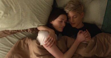 Image from Feel Good of Mae Martin and Charlotte Ritchie cuddling together in a bed