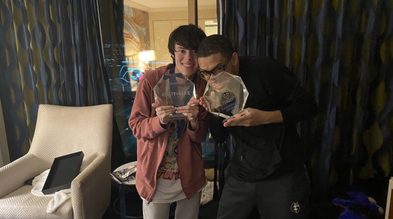 Photo of UMISHO and SonicFox posing together with their EVO 2022 trophies