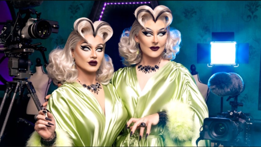 Boulet Brothers posing in drag wearing lime green silk robes in a promo for Dragula