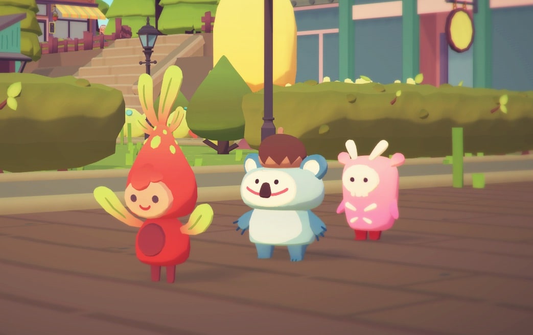 Three ooblets walking in a line down a road