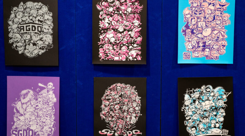 Photo of framed drawings from each year of GDQ