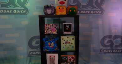 Photo of the Summer Games Done Quick background with a shelf full of video game memorabilia
