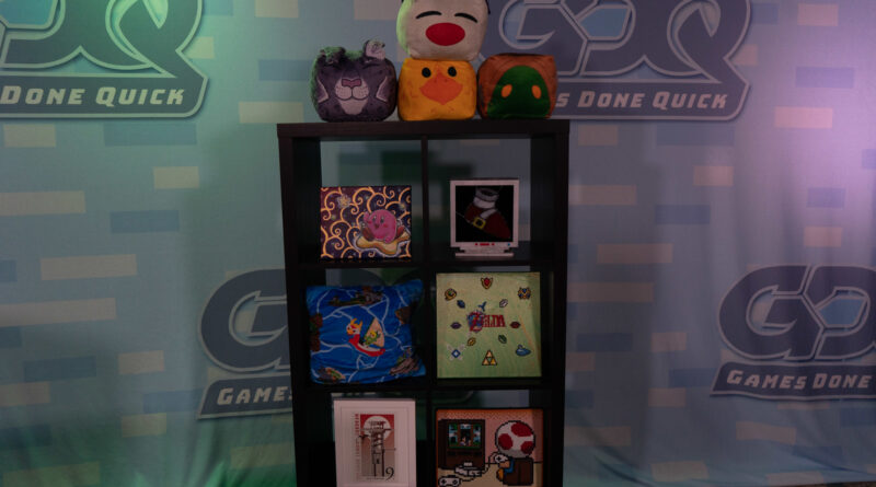 Photo of the Summer Games Done Quick background with a shelf full of video game memorabilia