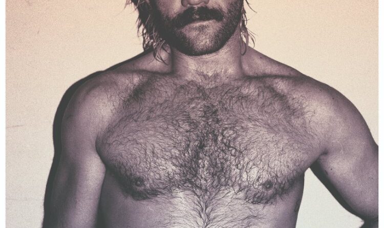 Sepia tone photo of EFFYLives posing shirtless