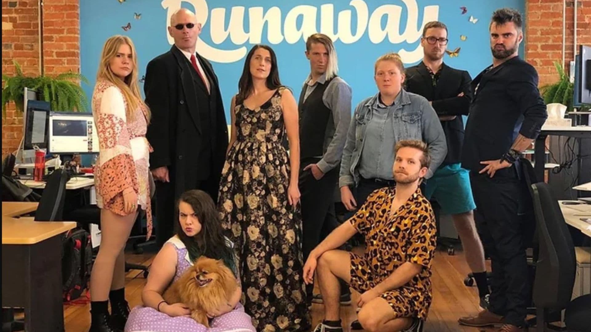 Runaway Play team posing for a group photo for Game Dev Fashion Week