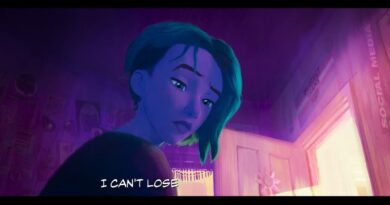 A screenshot from the Spider-Man Across the Spider-Verse trailer showing Gwen in a room with a "protect trans kids" sign on the wall