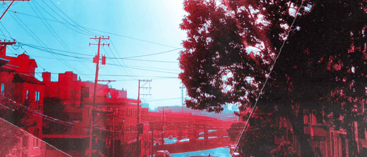 Photo of a street with a filter that makes everything red and blue from Three Days to Chicago