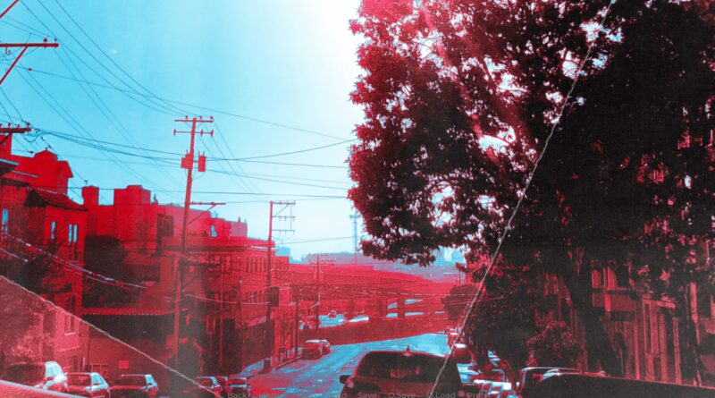 Photo of a street with a filter that makes everything red and blue from Three Days to Chicago