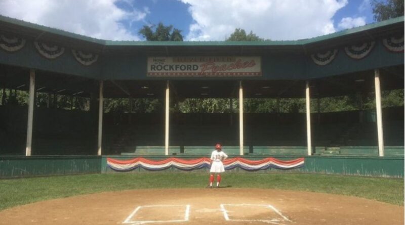 Photo of Abbi Jacobson in her A League of Their Own costume on a baseball field