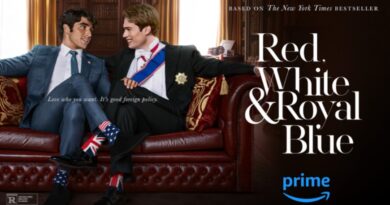 Red White & Royal Blue art featuring the two main characters sitting on a leather couch together.