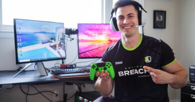 Doug "Censor" Martin Call of Duty holding a controller and pointing while wearing his Boston Breach Call of Duty League jersey