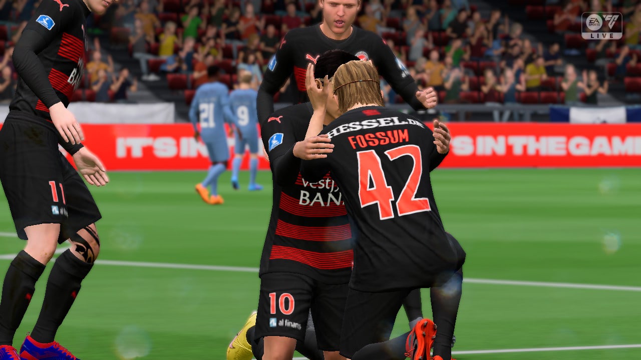 EA FC 24 screenshot of two players on their knees touching foreheads after scoring