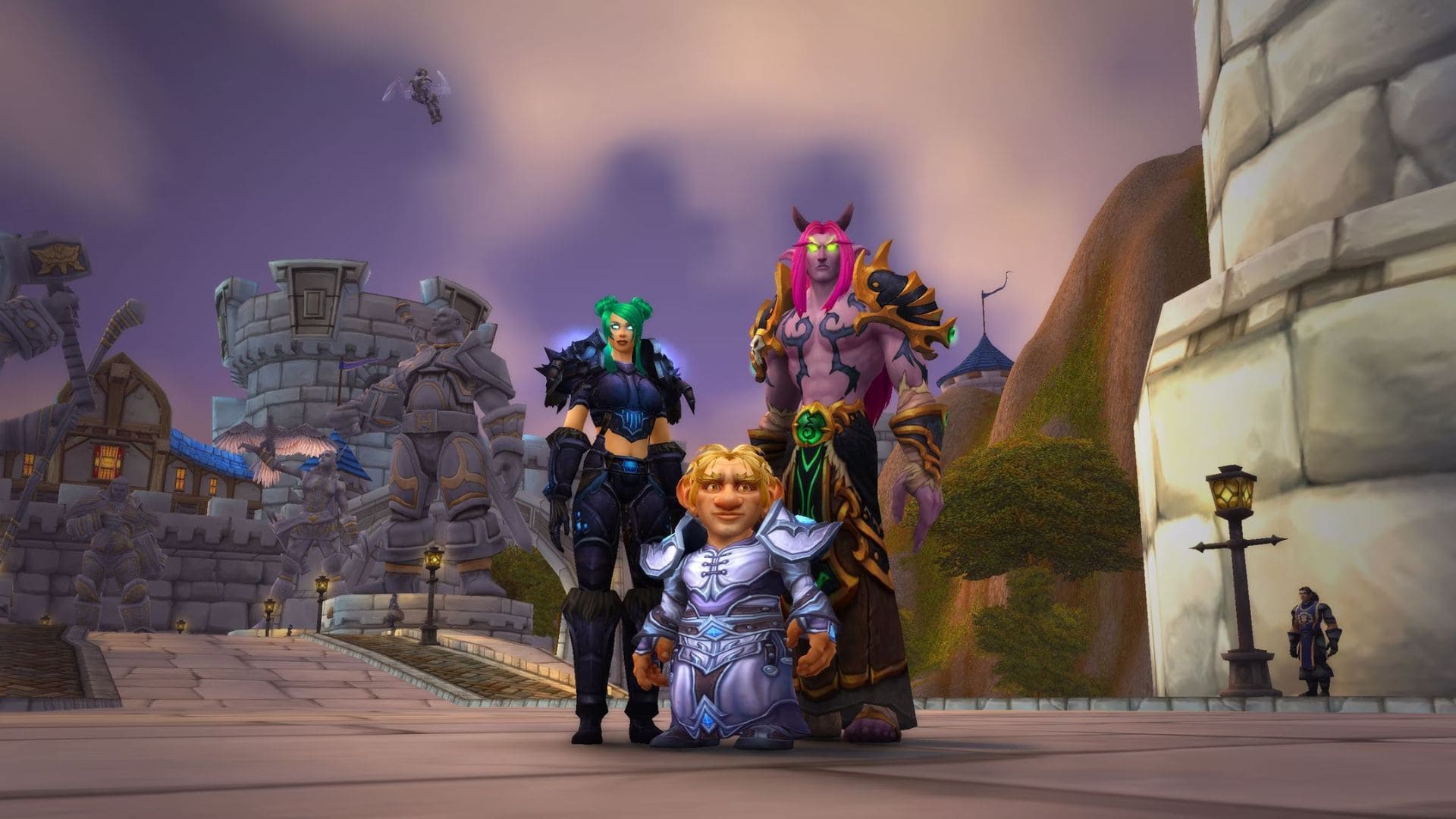 Screenshot of three World of Warcraft characters standing together facing the camera.